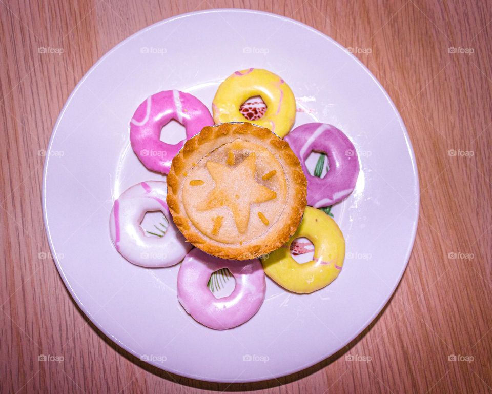 Colorful ice ring biscuits and a pie.