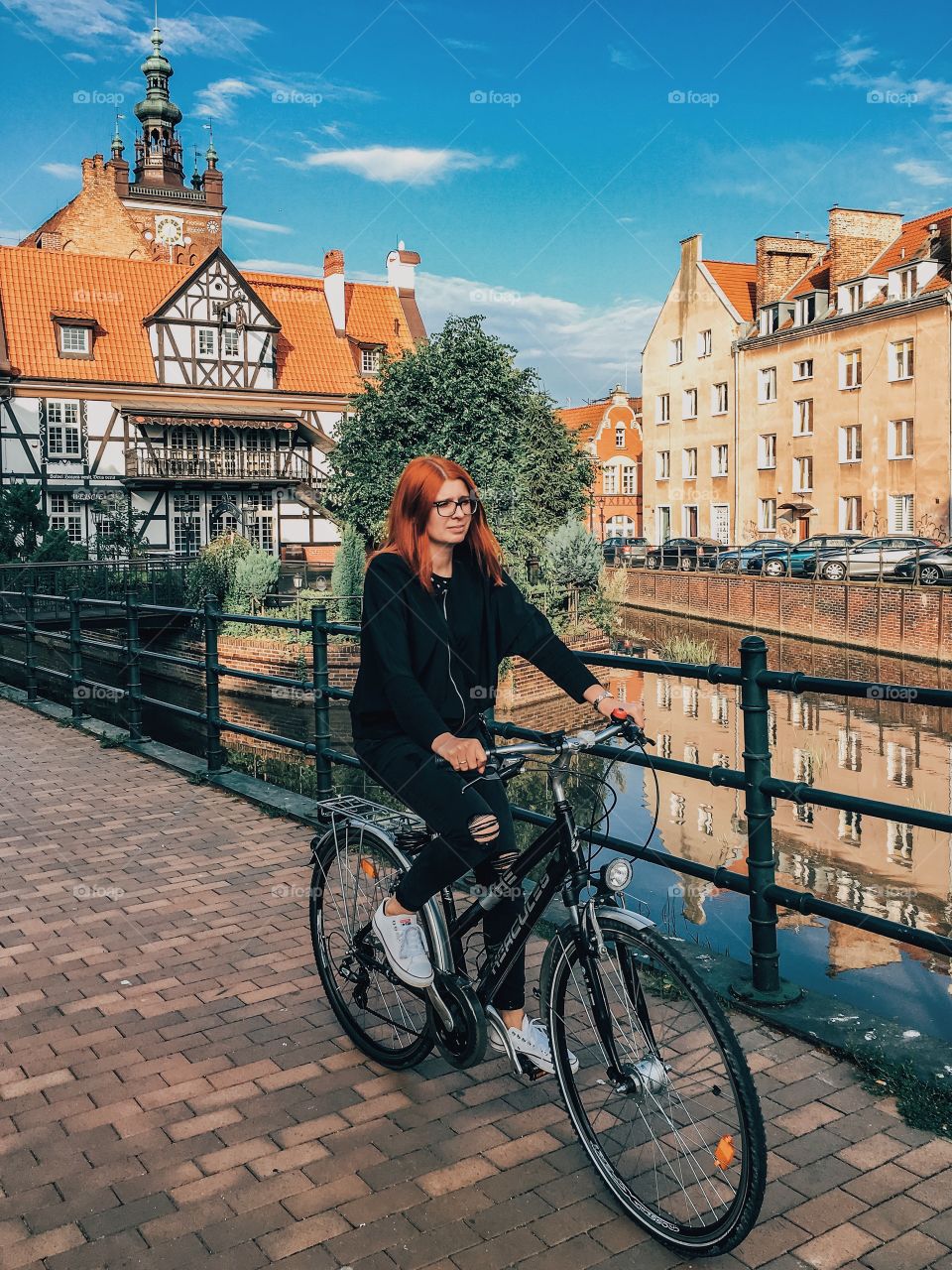 Woman cycling in city
