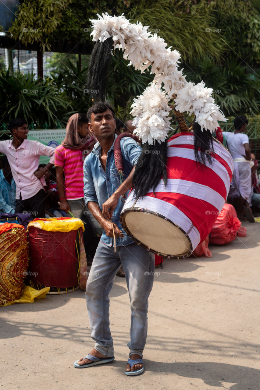 Dhakis (Bengali: ঢাকি) are traditional drummers who play the dhak (drum) during Hindu festivals, primarily in Bengal. Drum beats are an integral part of the five-day-long annual festivities associated with Durga Puja.