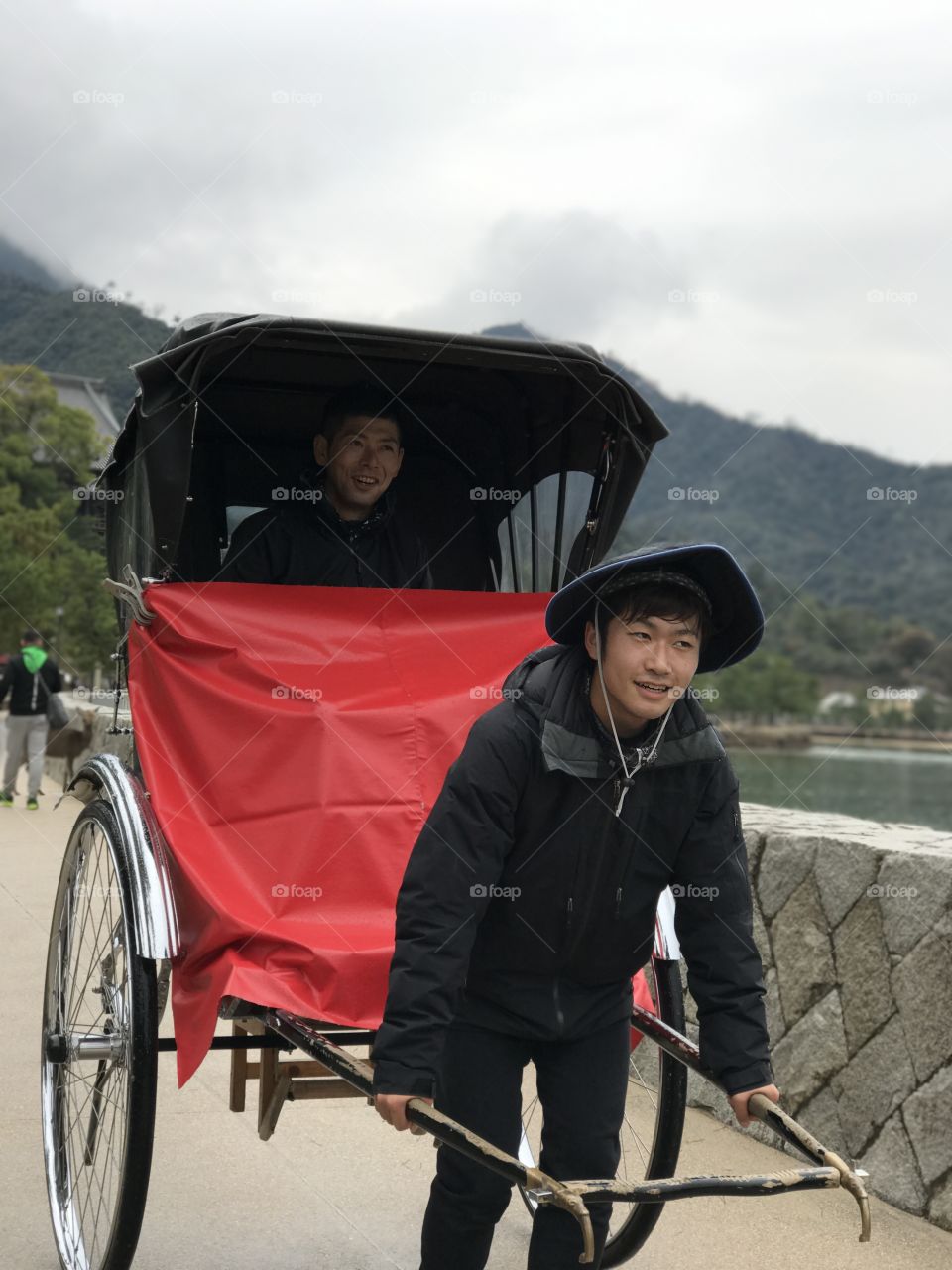 Asian man with handcart