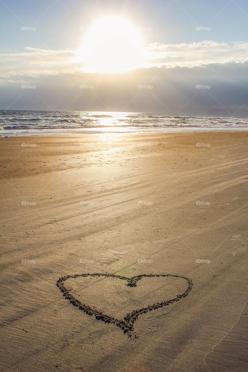 Harte shape on sandy beach