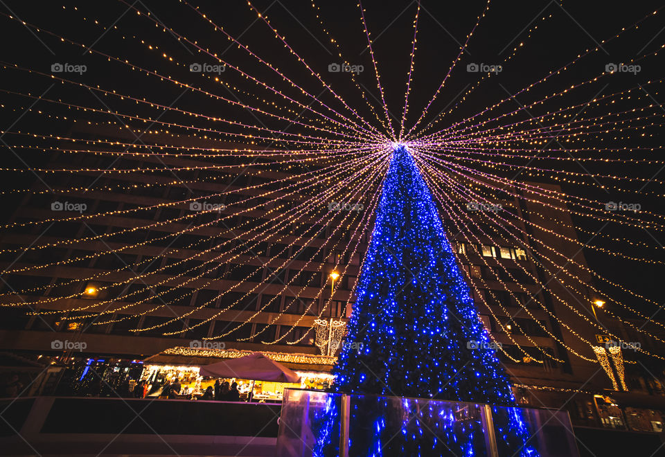 Illuminated blue christmas tree with blue lights