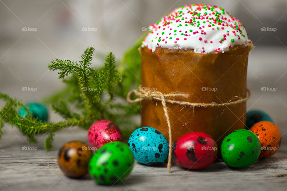 Traditional Easter bread paska with colored quail eggs