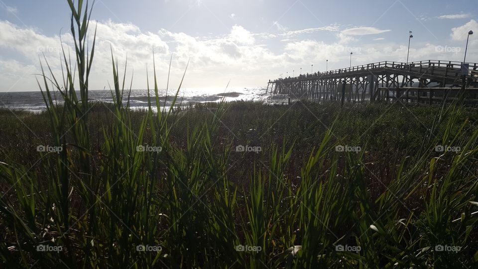 Kure Beach Pier. This pier is off the coast of North Carolina in a small beach town called Kure Beach.