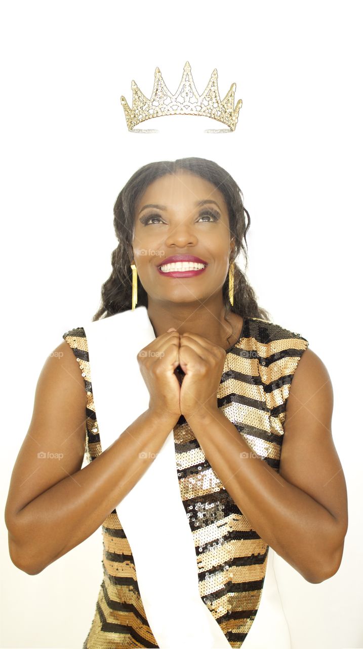 Queen Me. A woman receives a crown. 