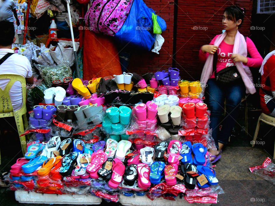 street vendor selling slippers