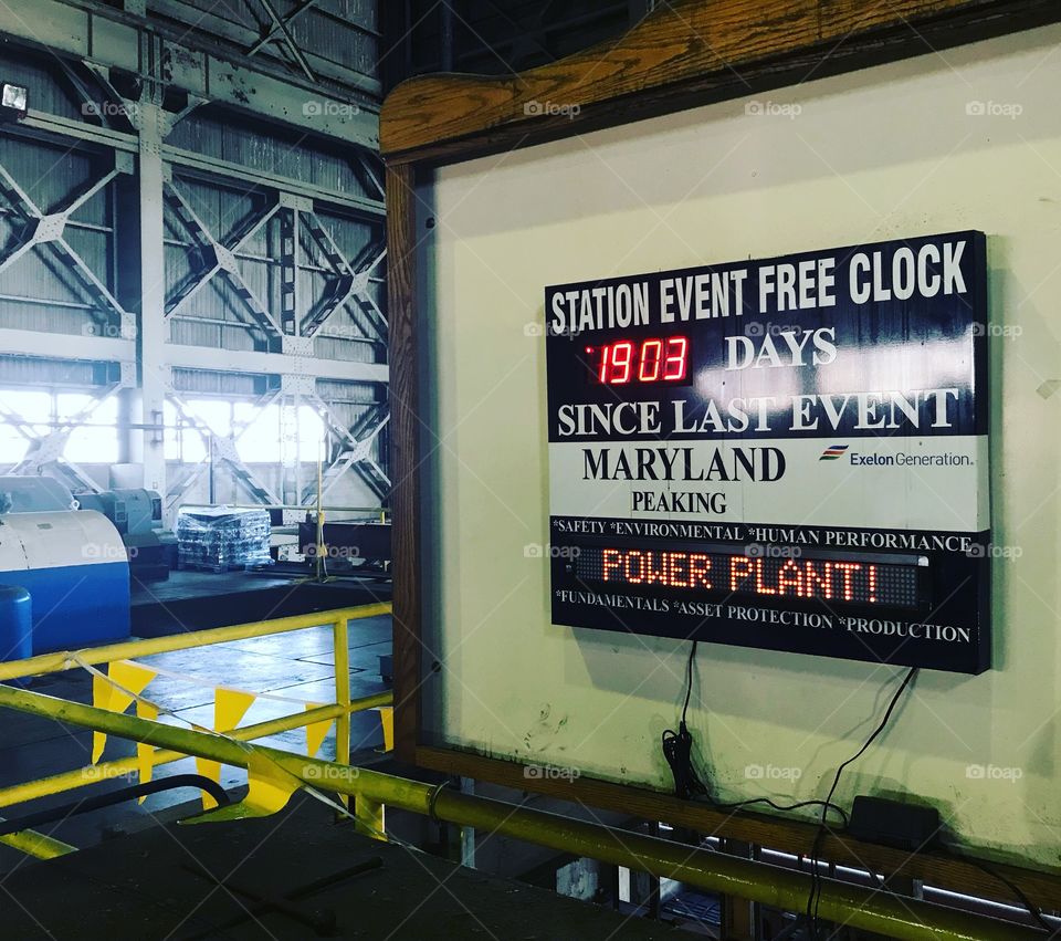 Interior of a multilevel industrial electrical power plant with gritty textures. Includes a digital wall mounted safety clock in Baltimore Maryland. Count down since last work place injury. 