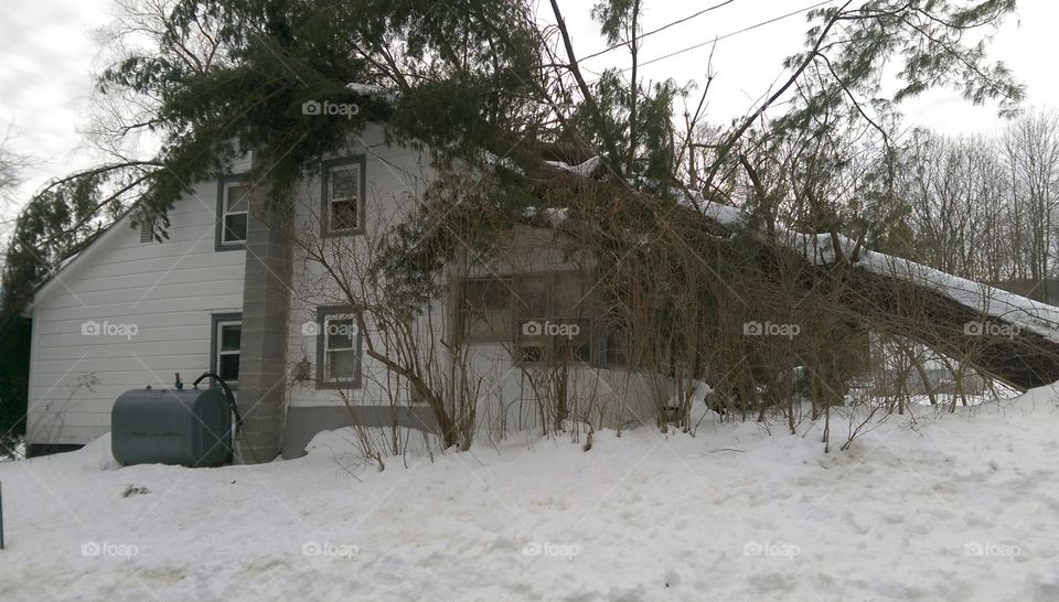 Abandoned house damaged during blizzard