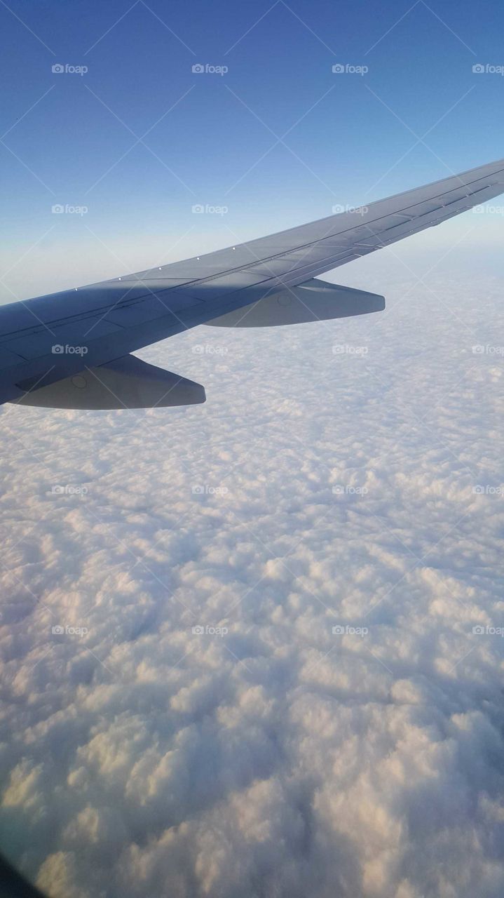 Flying over cloudy sky