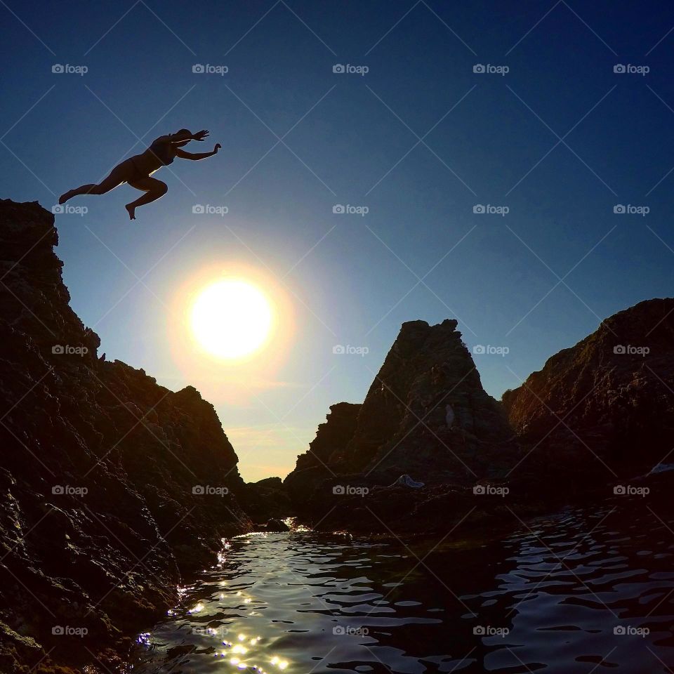 Cliff-jumping at dusk