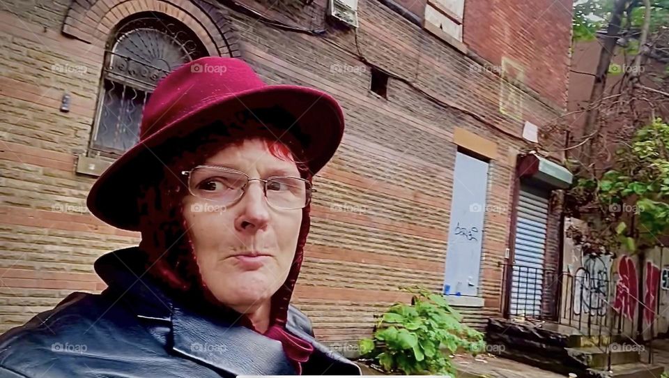 This is me, “Petra Schiller” a.k.a. “Maxine Firefox” a.k.a. “Maximiliane Feuerfuchs” in my coordinated Fall season burgundy wool, velvet and black leather outfit striking a pose on “Waverly Av” in “Clinton Hill”, Brooklyn. 2022. Hypnotic Productions