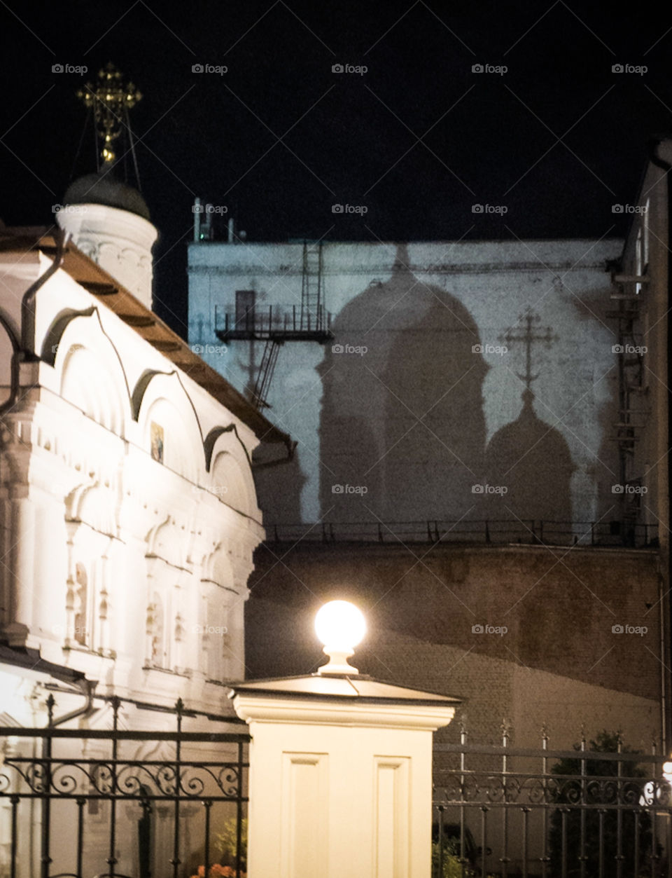 Russia, Moscow.  Autumn evening.  Shadow of the domes of the Orthodox Church on a brick wall