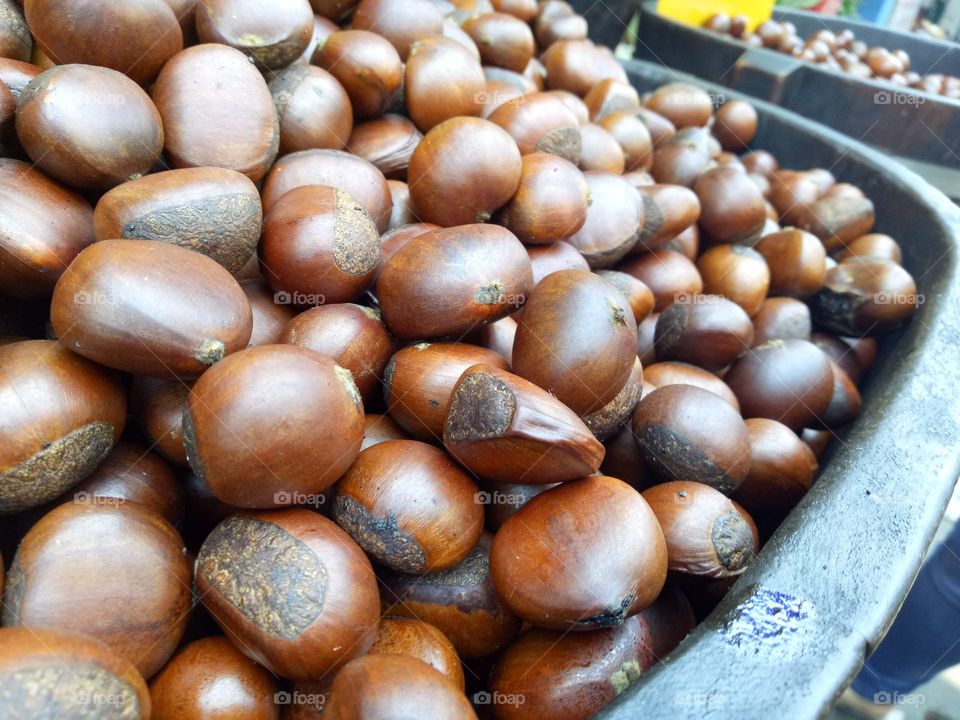 Roasted chestnuts in the market. Closed up view of roasted chestnuts.