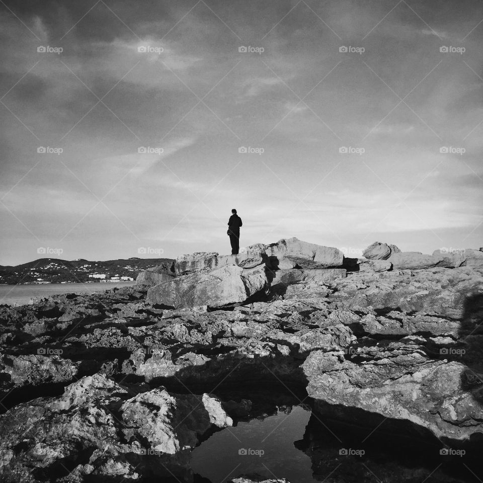 Man on the rocks in BW 