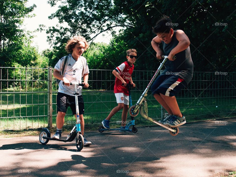 „Impossible“ is just a word!. Some kids in a park having fun!