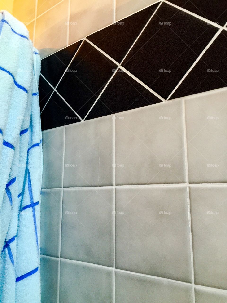 Shower towel and tiles 