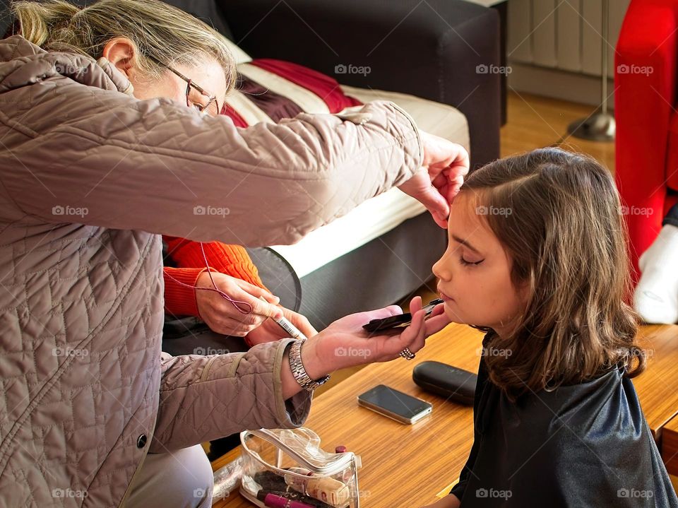 A grandmother makes up her granddaughter