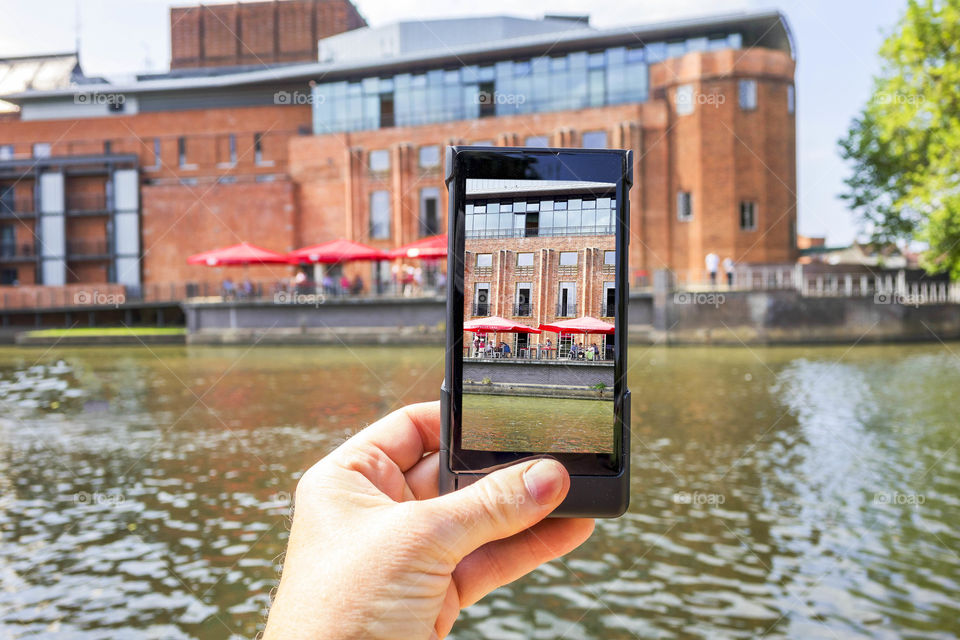 Phone. Camera phoneTourist taking a picture with a smartphone cell phone mobile phone camera 