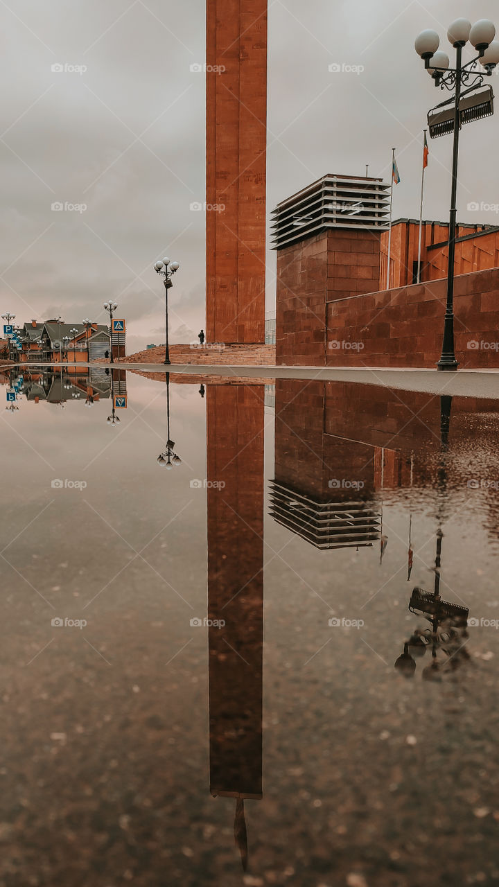 Reflection in autumn puddle