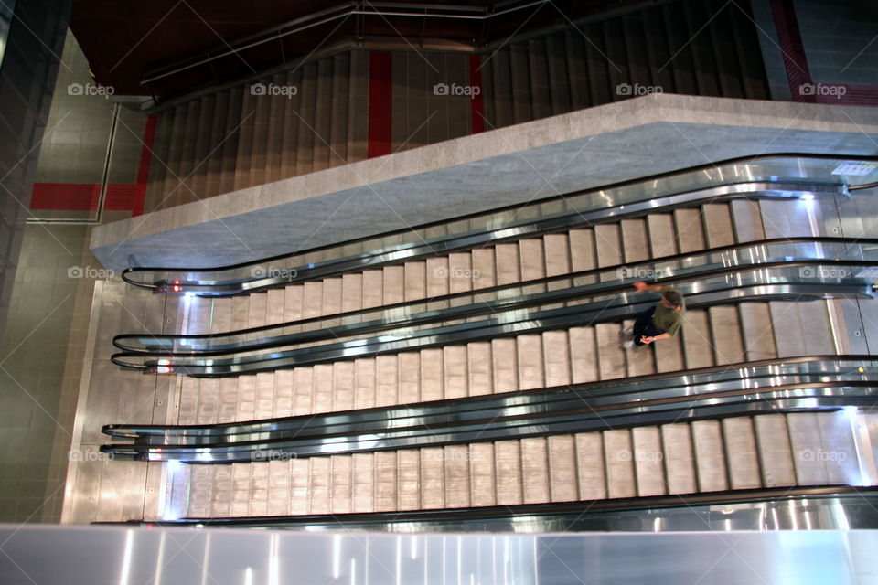 man on escalator