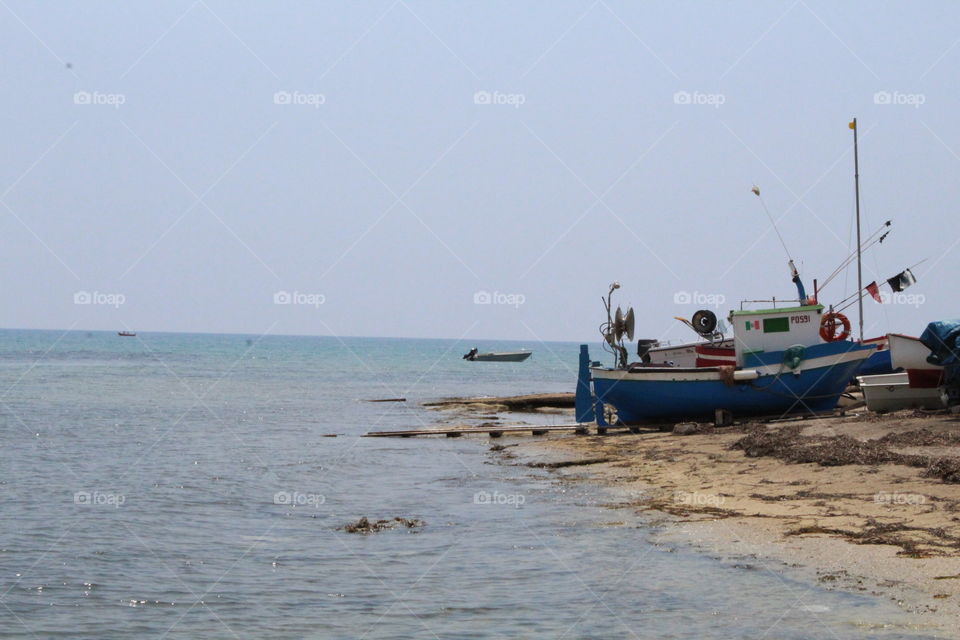 boat resting on the beach