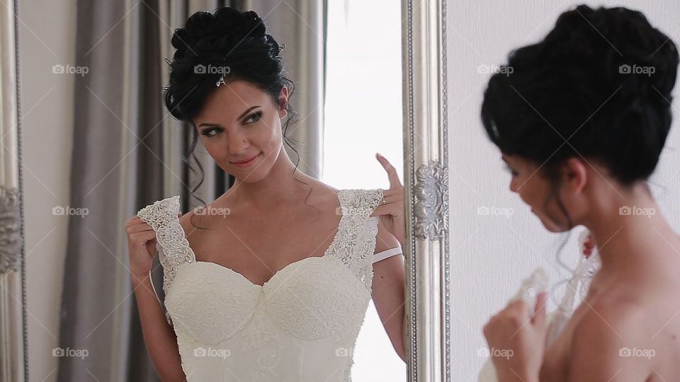 Bride near mirror 