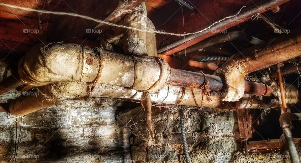 old asbestos wrapped pipes