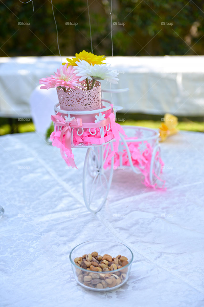 a bicycle with a oink basket center piece in a party