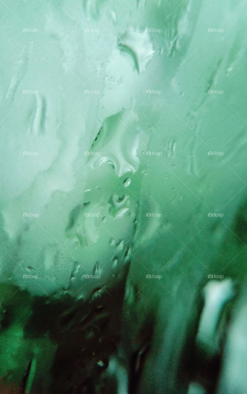 Rain on a tinted window.