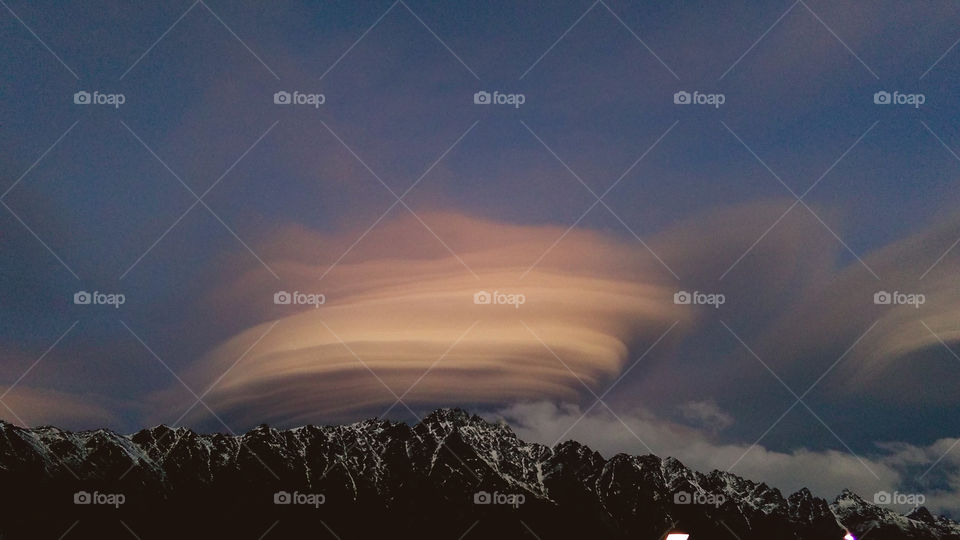 Lenticular clouds over the mountain