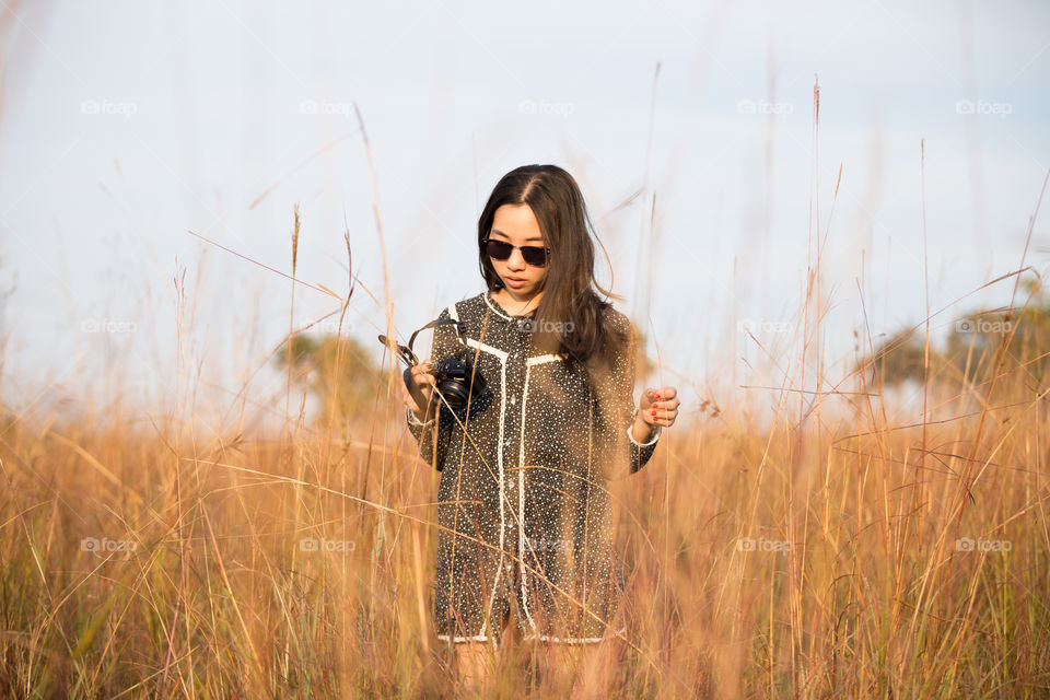 Asian girl in the field grass