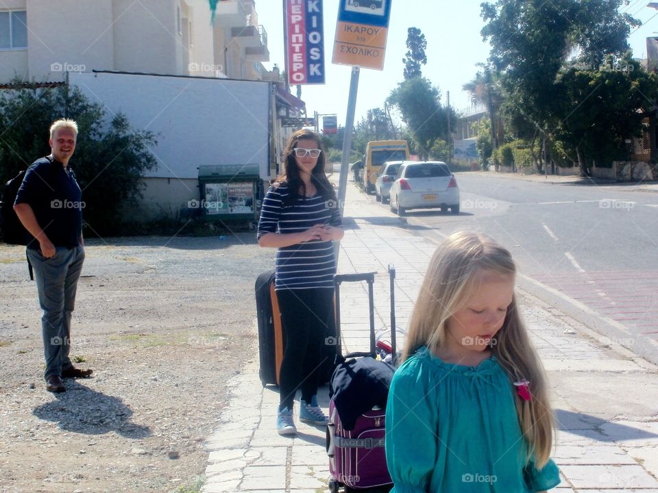 Bus stop . Waiting bus with family