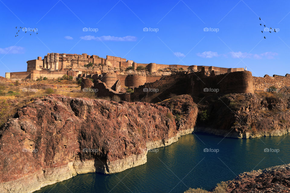 Mehrangarh Fort up on the hill alongside a lake in Jodhpur, Rajasthan, India