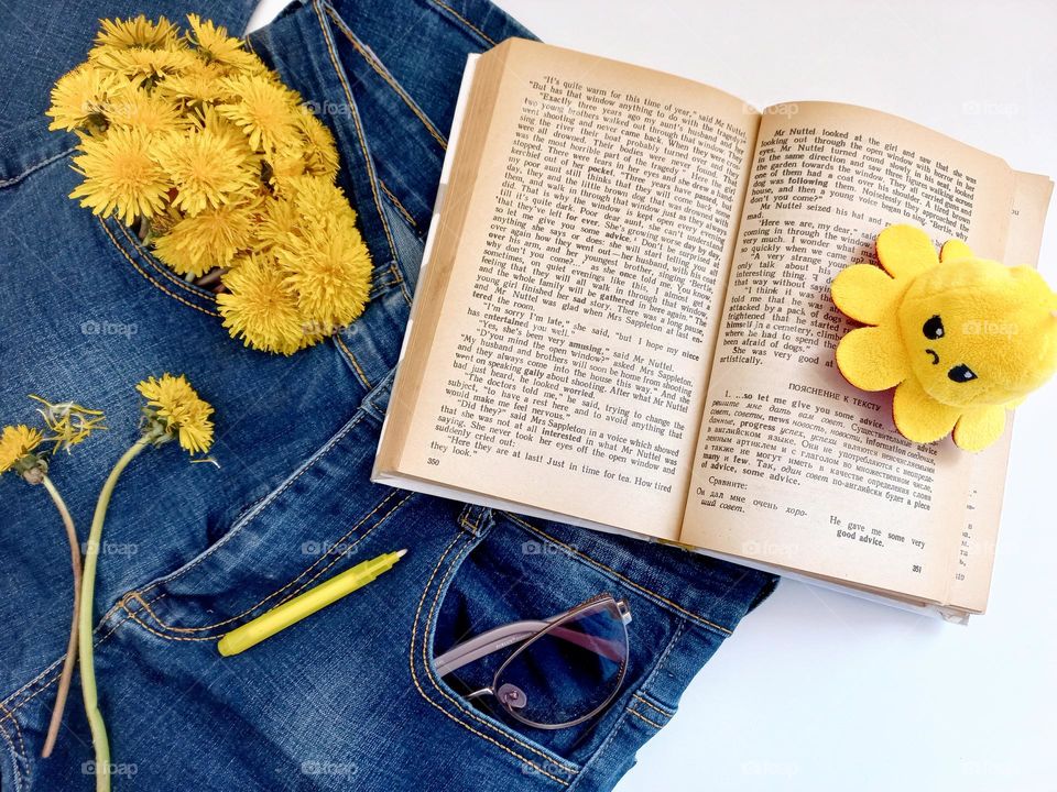 book, jeans and glasses