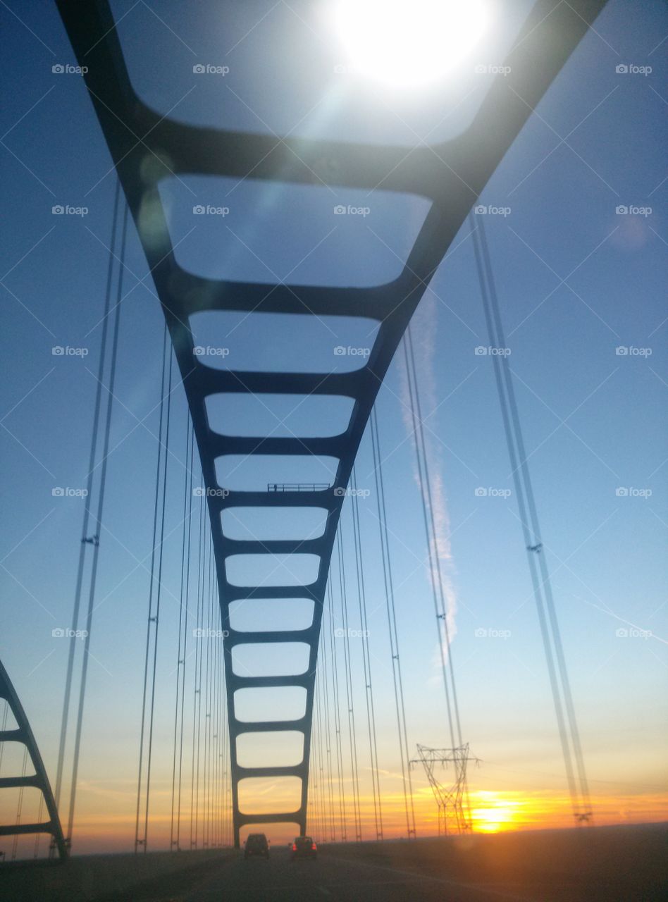 Sunset Bridge. Driving over the river at sunset. 
