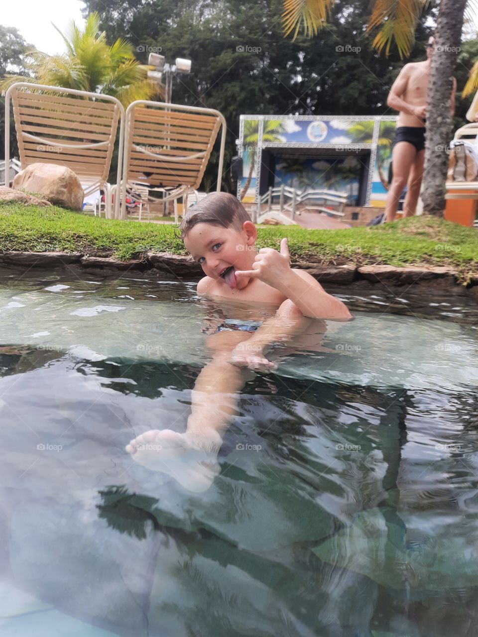 smiling child playing in hot park club