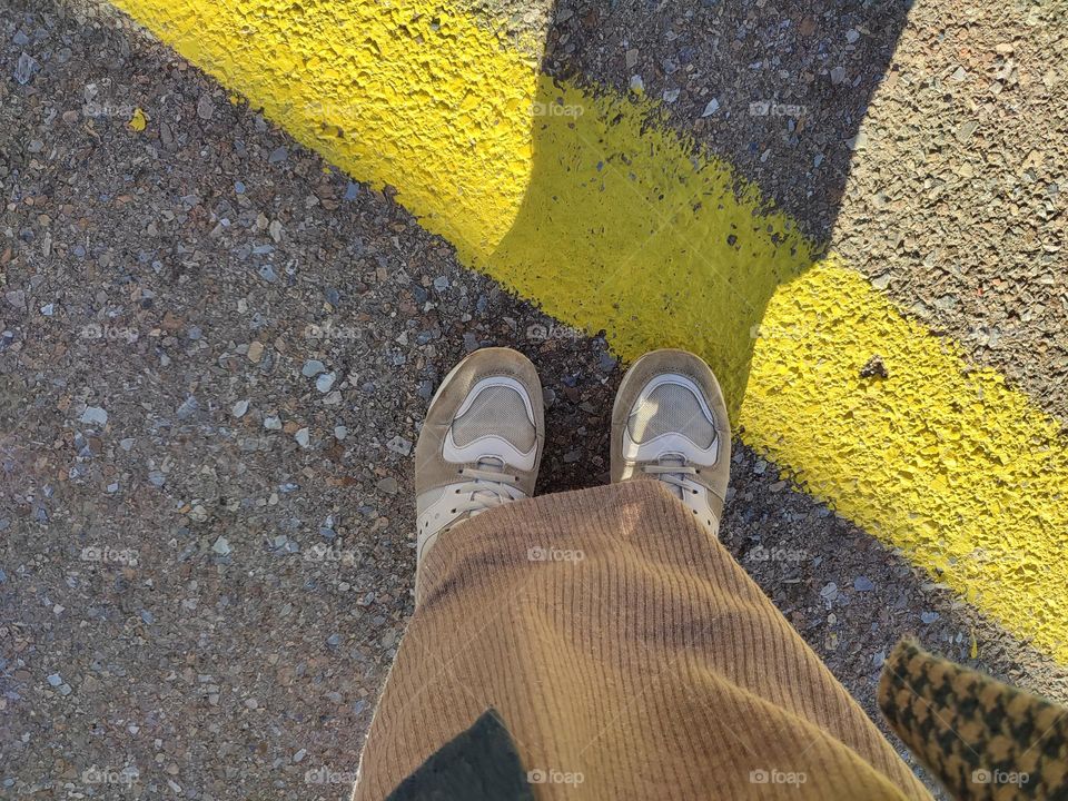 standing on yellow line 💫 ( grey and yellow colors on the street)