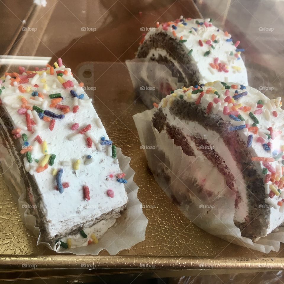Chocolate cake rolls with rainbow sprinkles 