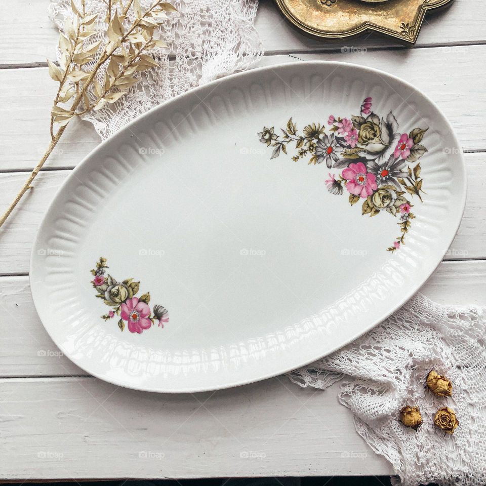 White old oval dish with floral ornament