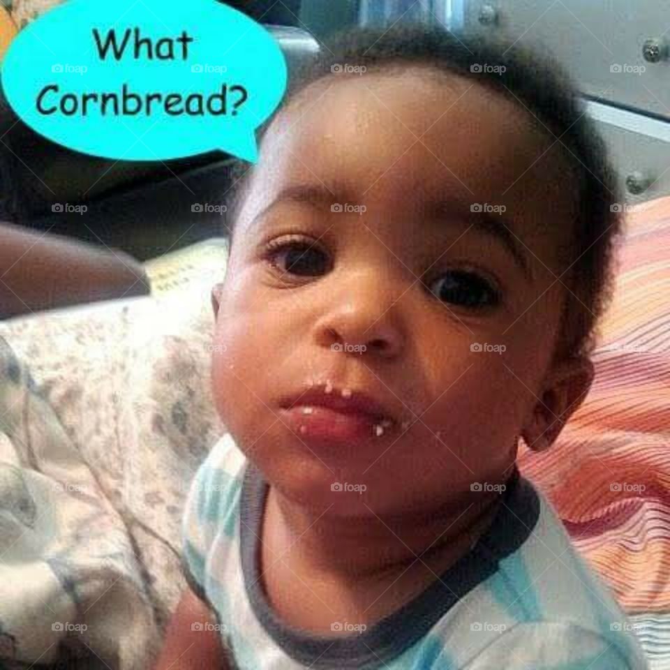 baby with crumbs on face