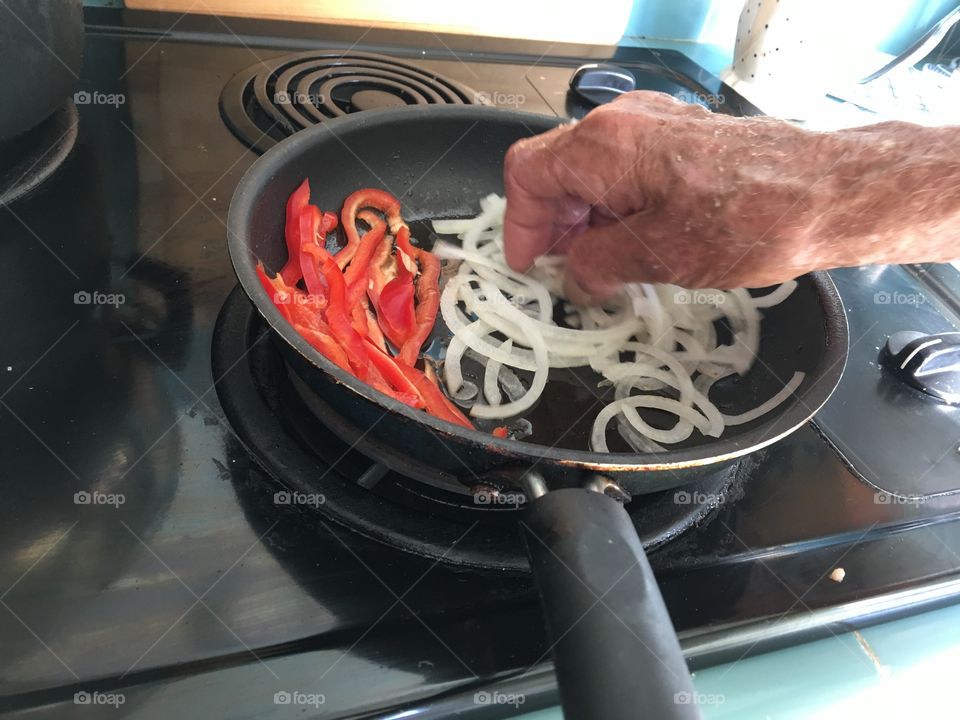 Preparing topping for pizza