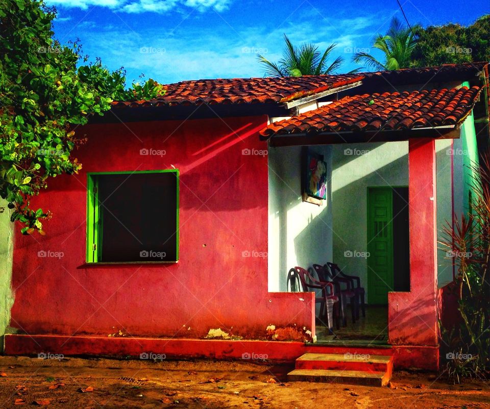 small red house on the coast of southern Bahia, Brazil