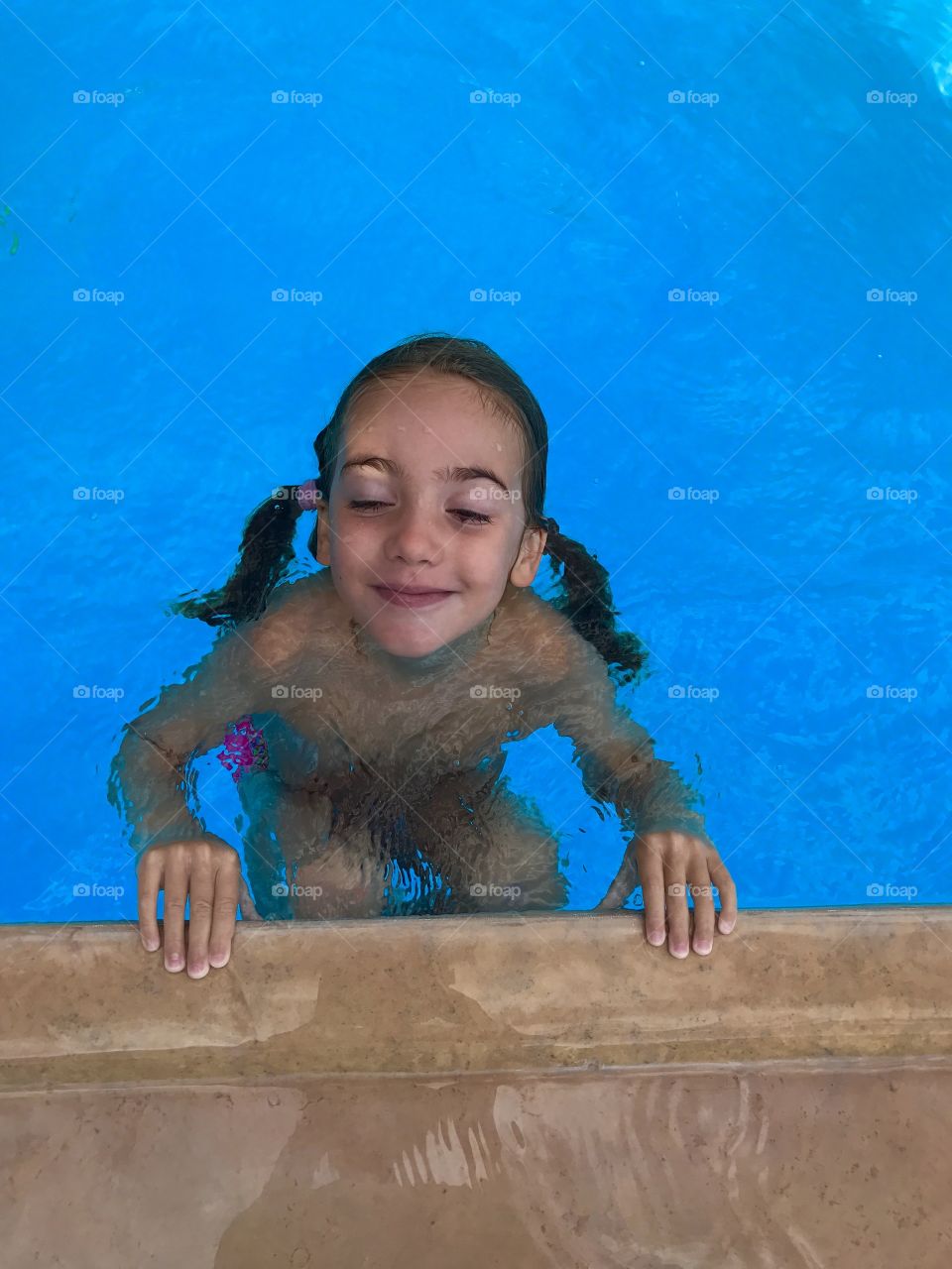 Little girl in a pool