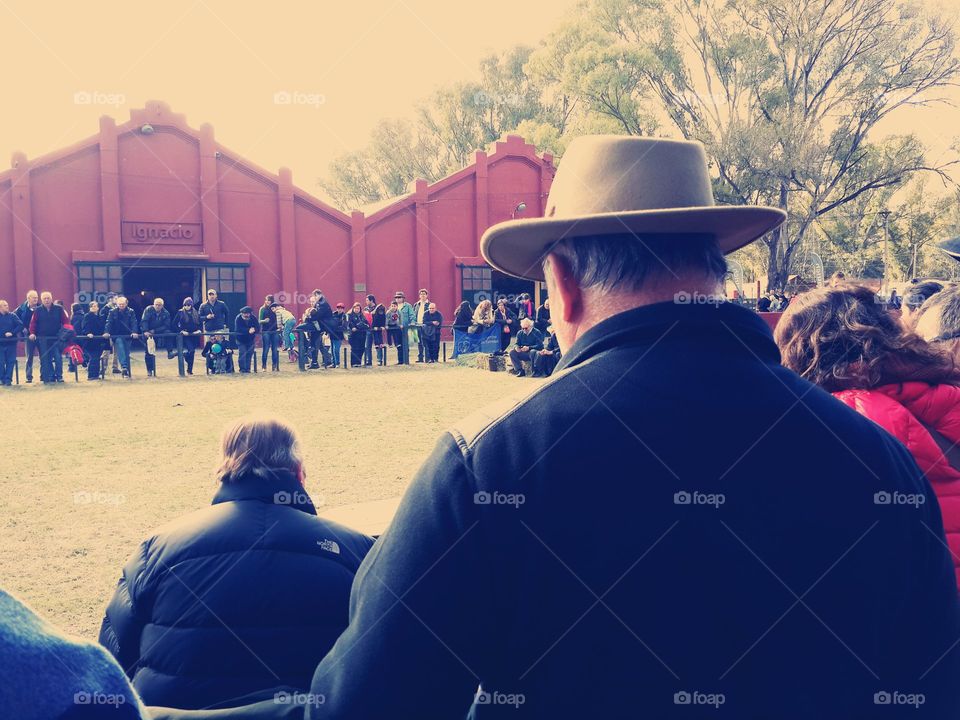Man with hat from behind
