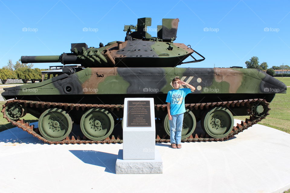 salute pose by the tank