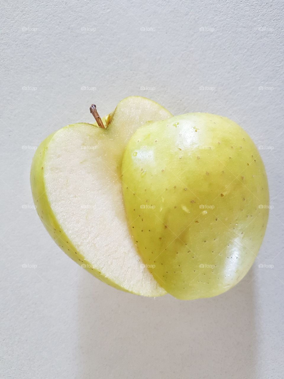 Studio shot of slice green apple