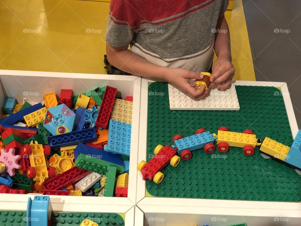 Boy building lego toys