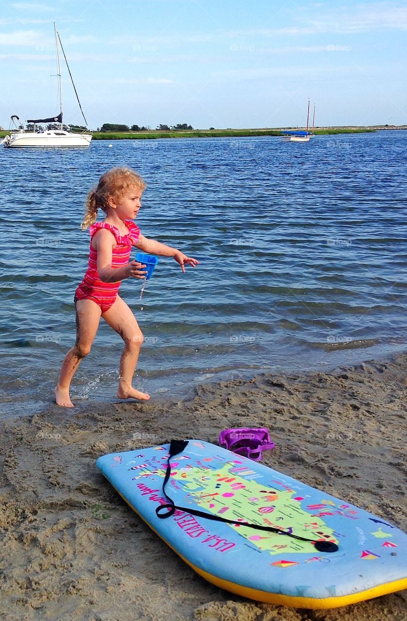 Very, very busy.  Play is hard work at the beach...