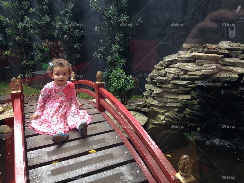 Japanese garden. Kid platina in a japanese garden