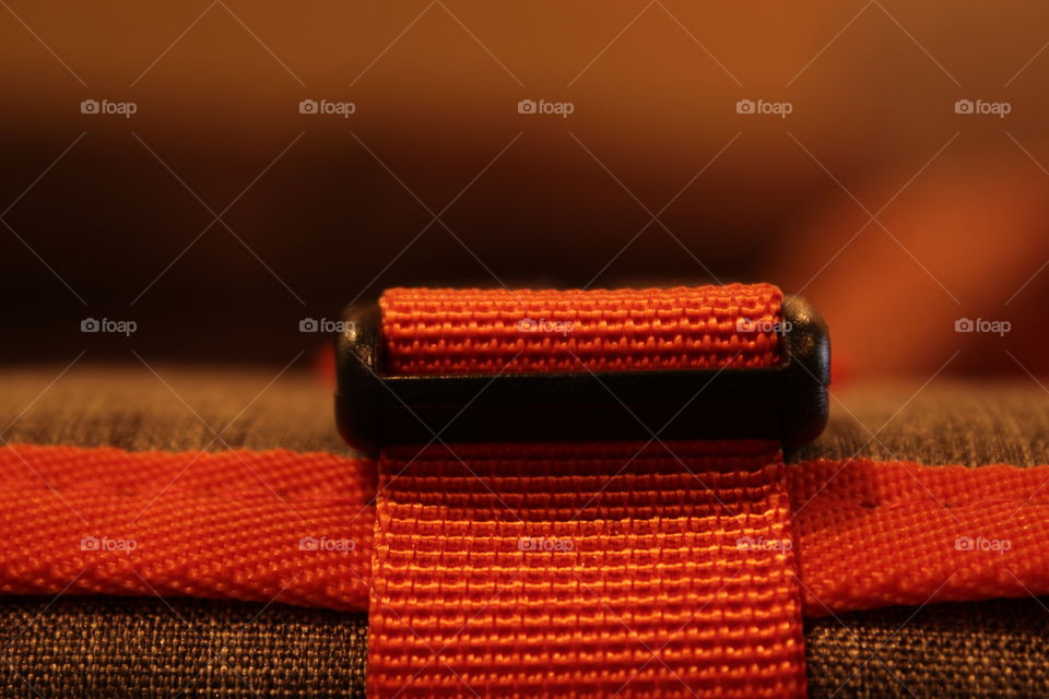 Orange and grey travel organizer strap close-up